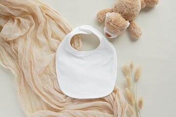 White cotton fabric baby bib mockup for design presentation, bohemian style flat lay, pregnancy...