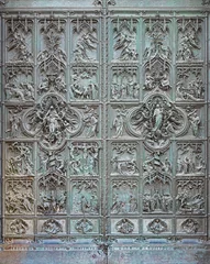 Foto auf Acrylglas MILAN, ITALY - SEPTEMBER 16, 2024: The main bronze gate of the Cathedral with the new testament scenes by Ludovico Pogliaghi (1906). © Renáta Sedmáková