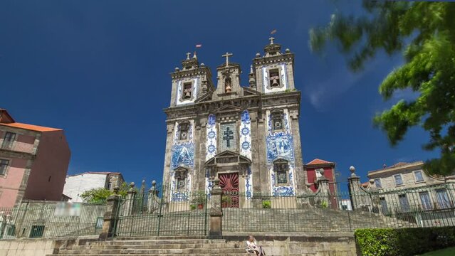 Church of Saint Ildefonso timelapse hyperlapse. Igreja de Santo Ildefonso, covered with typical Portuguese tiles called Azulejosa, 18th century building in Baroque style, in Porto, Portugal