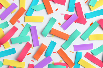 Colorful paper confetti decoration on white background, flat lay top view concept for party or celebration theme