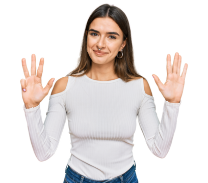Young hispanic woman wearing casual clothes showing and pointing up with fingers number nine while smiling confident and happy.
