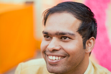 A groom posing for his wedding photo in a big fat Indian wedding celebrated in India. Indian groom...