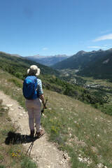 Hiker on a path in the Ecrins National Park. - 775059675