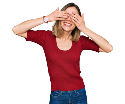 Young blonde girl wearing casual clothes covering eyes with hands smiling cheerful and funny. blind concept.