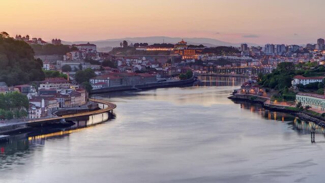 Aerial view before sunrise at the most emblematic area of Douro river timelapse night to day transition. World famous Porto wine production area.