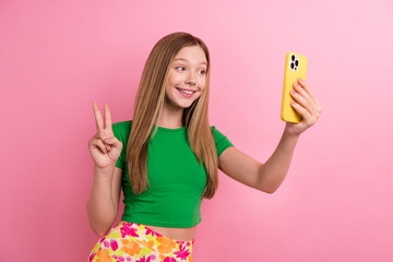 Photo portrait of pretty teenager girl selfie photo show v-sign wear trendy green outfit isolated...