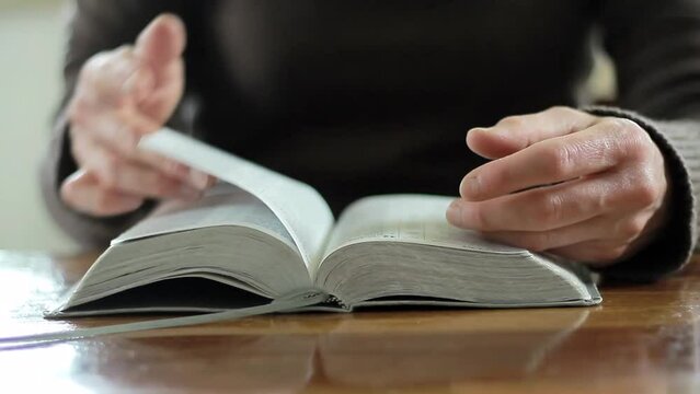 praying to God with the bible on black background with people stock footage stock video