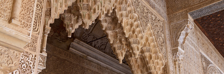 Rich decorations in Arabic style in the Royal Nazaries Palace in Alhambra, Granada, Andalusia, Spain