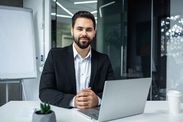 bearded man businessman looking at camera. Portrait of successful bank worker, manager, employee