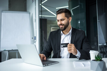 Happy man, business credit card and laptop for ecommerce, finance and accounting in office. Manager, computer and financial payment of budget - 775084488