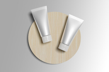 Two cosmetic cream tube branding mockups on a wooden board