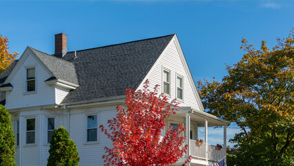 Classic American style two-story home on an autumn clear sky day in Brighton, Massachusetts, USA