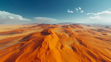 Fototapeta na wymiar An aerial view of a vast desert landscape with winding sand dunes stretching into the distance