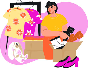 Woman packing used clothing for Garage sale or donation box. Declutter of closet, sorting for sale, recycle or donation of unwanted clothes.