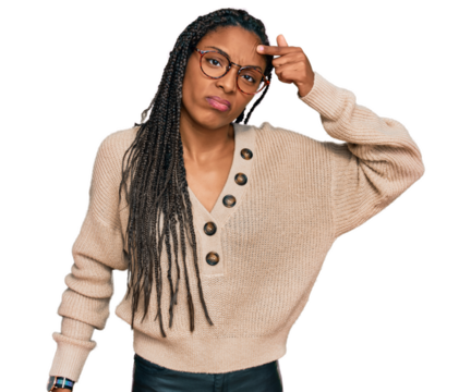 African american woman wearing casual clothes pointing unhappy to pimple on forehead, ugly infection of blackhead. acne and skin problem