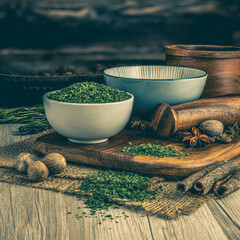 ENGLISH PARSLEY DRIED on wooden table background. Herbs, spices and dried food baking ingredient....