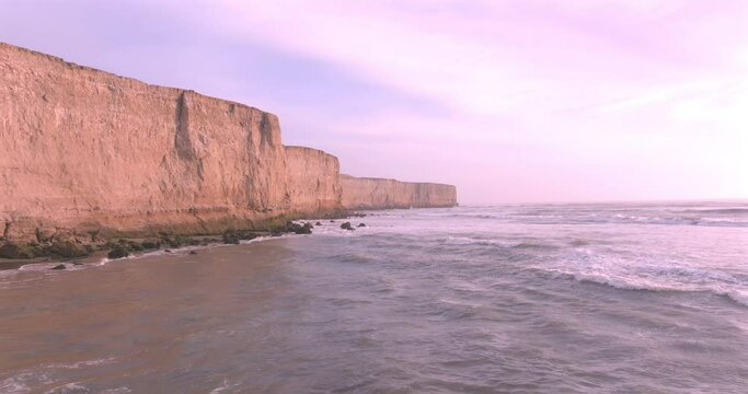 Aerial View of Stunning Cliffs Bathed by Waves in a Tranquil coast. Puerto Eten, Peru. 