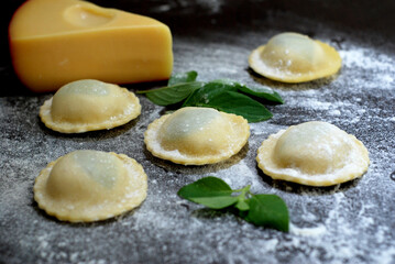 Italian Raviolli, dumplings on a wooden board