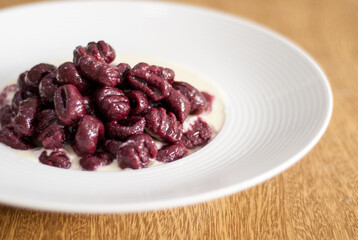 Beet Gnocchi with white sauce