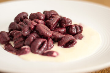 Beet Gnocchi with white sauce