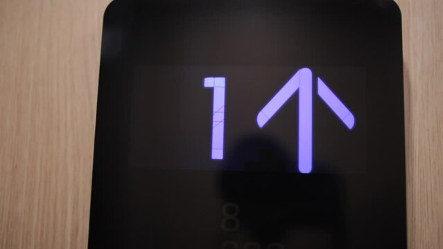 In elevator of modern business center on electronic LCD display. View of the panel with the number. The monitor counting numbers from zero to seven.