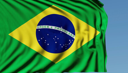 Close-up of the national flag of Brazil flutters in the wind on a sunny day