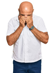 Mature middle east man with mustache wearing casual white shirt rubbing eyes for fatigue and...