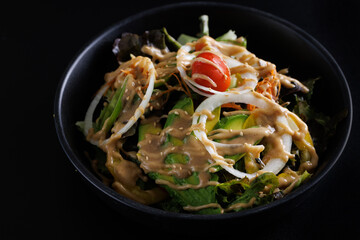 Japanese salad isolated in black background - 775119859