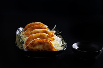 Gyoza Japanese food dumpling isolated in black background - 775120633