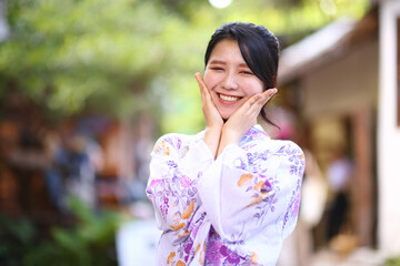 portrait woman with yukata dress in the garden - 775122280