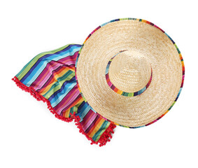 Mexican sombrero hat and colorful poncho isolated on white, top view