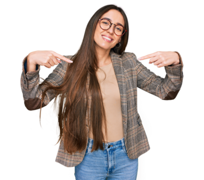 Young hispanic girl wearing business clothes and glasses looking confident with smile on face, pointing oneself with fingers proud and happy.
