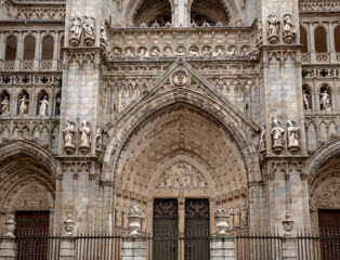 Fototapeta na wymiar Detail of the main facade of the Gothic cathedral of Toledo, Castilla la Mancha, Spain, declared a world heritage site by UNESCO