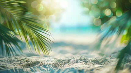 Beautiful blurred background of an exotic beach with fine sand and palm leaves on the edge, bokeh in sunlight. summer vacation concept. copy space for text or product