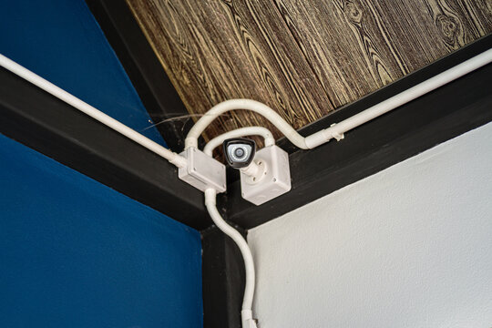 A security wireless camera which is installed at ceiling, using to monitor around the area. Technology and object photo.