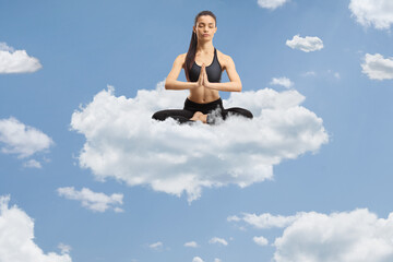 Young female practicing meditation on a cloud