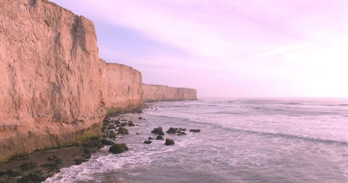 Aerial View of Stunning Cliffs Bathed by Waves in a Tranquil coast. Puerto Eten, Peru. 