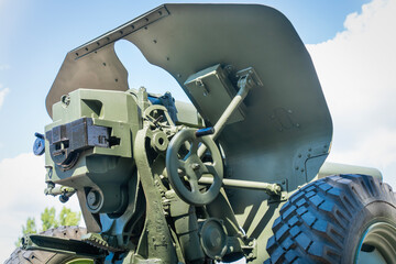 Green painted old Soviet 122 mm howitzer from the rear