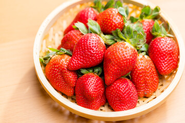 Red strawberry over the basket
