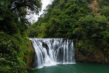 Fototapeta na wymiar Beautiful Shifen waterfall in Pingxi at Taiwan