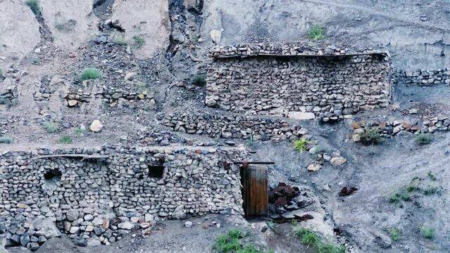 Old villages in Tajikistan. Tajikistan's road along the Zeravshan River near the Pamir highway. Old stone villages in the mountains of the Silk Road. 4К