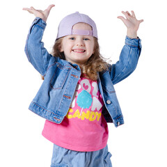 Portrait of a beautiful kid girl in cap and jeans jacket smiling, looking, happiness, hands raised up on white background isolation