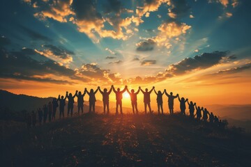 Silhouettes of people holding hands and celebrating success with arms raised against the sky at sunset, representing community support for individuals in need.