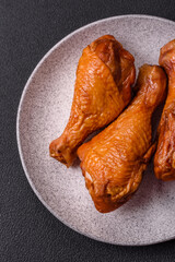 Delicious chicken legs baked on the grill with salt, spices and herbs