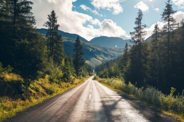 A captivating view of a mountainous landscape with a road extending through a lush green forest under a bright sky