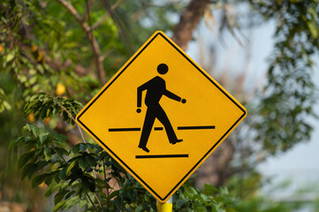 pedestrian crossing sign on green nature