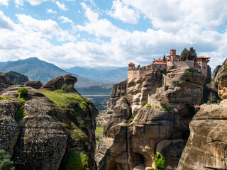 Meteora Monasteries and the surrounding rock formation on a partly cloudy day 11
