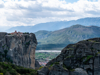 Meteora Monasteries and the surrounding rock formation on a partly cloudy day 5