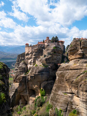 Fototapeta na wymiar Meteora Monasteries and the surrounding rock formation on a partly cloudy day 12