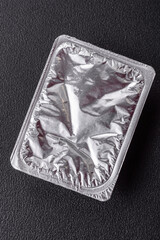 Rectangular plastic box with yogurt or cheese hermetically sealed with a foil lid